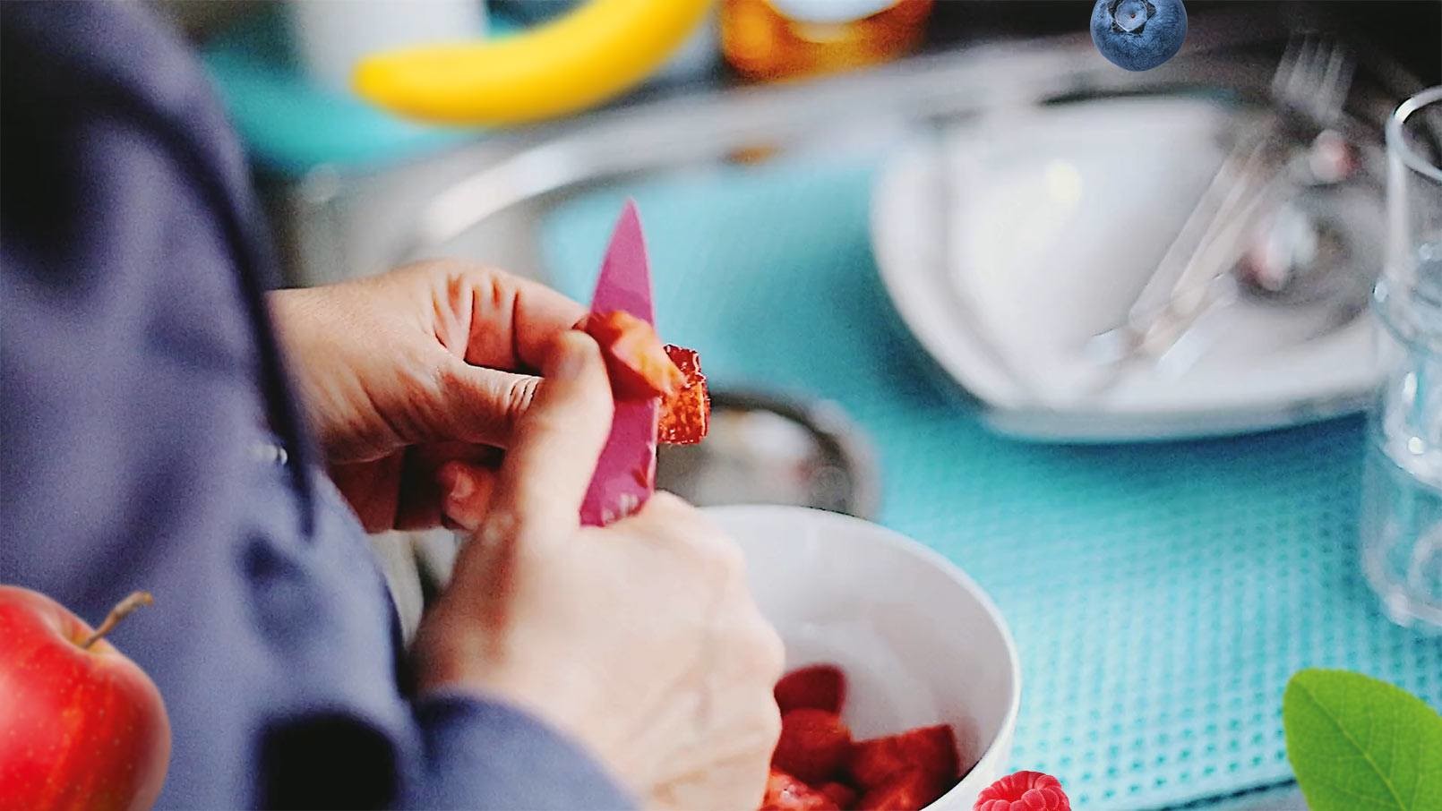 Man cutting strawberries